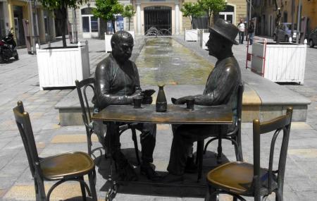Statue Of Men Playing Cards Image
